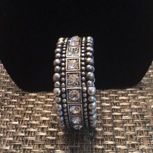 Silver bracelet with clear stone.